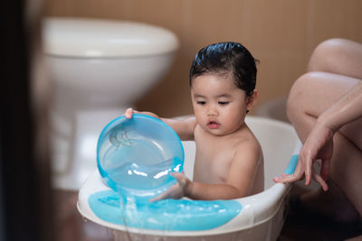 Boy looking at camera at home