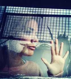 Close-up portrait of young woman in water