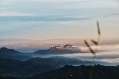 Scenic view of mountains against sky during sunset