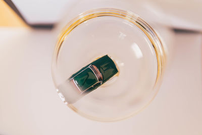 Miniature car in white wine glass