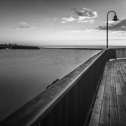 Pier over sea against sky