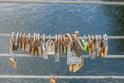 Close-up of padlocks hanging on railing