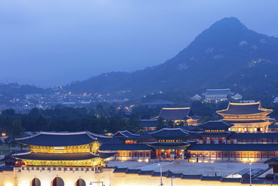 Illuminated buildings in city at night