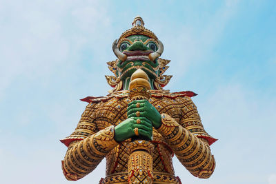 Low angle view of huge statue against sky