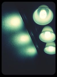 Close-up of illuminated light bulb