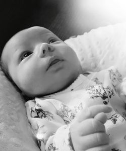 Young woman lying down on hardwood floor