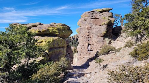 Rock formation on land against sky