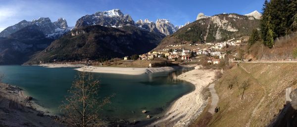 Panoramic view of buildings and mountains against sky