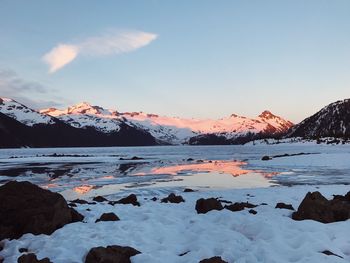 Scenic view of snowcapped mountains against sky during winter