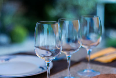 Close-up of wine glasses on table