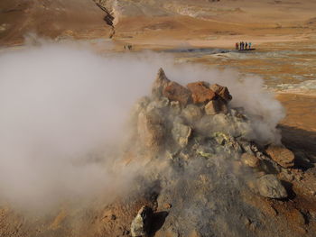 Smoke emitting from volcanic landscape