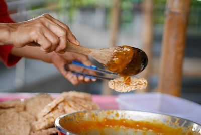 Close-up of person preparing food