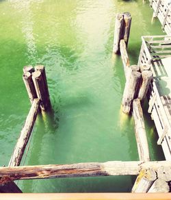 High angle view of wooden post in lake