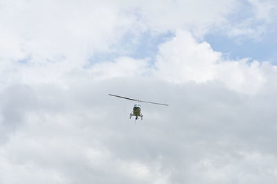 Low angle view of airplane flying in sky