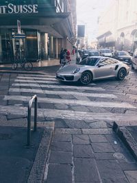 Cars parked on street in city