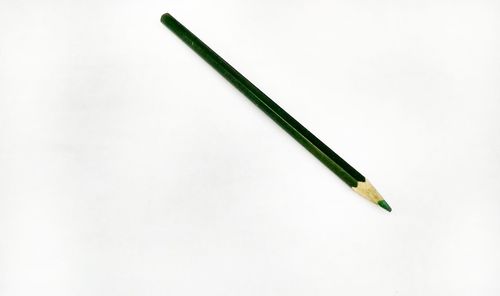 High angle view of colored pencils against white background