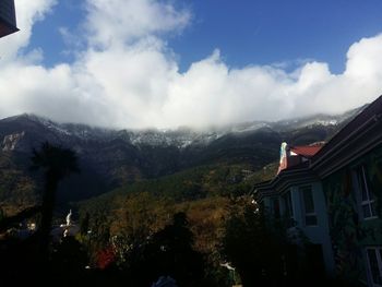 View of mountain range against cloudy sky