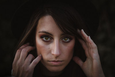 Close-up portrait of woman with brown eyes