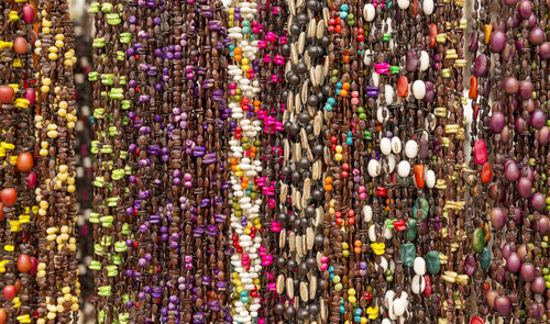 Full frame shot of multi colored decorations hanging at market