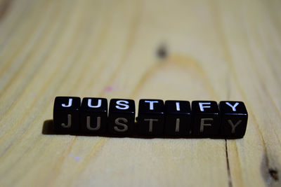 Close-up of information sign on table