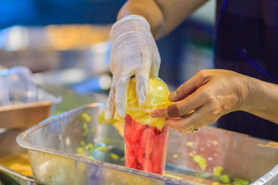 Close-up of person preparing food