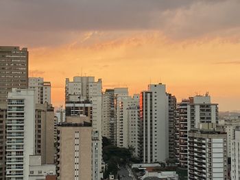 High angle view of buildings against sky during sunset