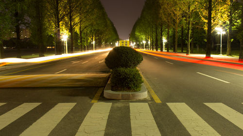 Light trails on street in city at night
