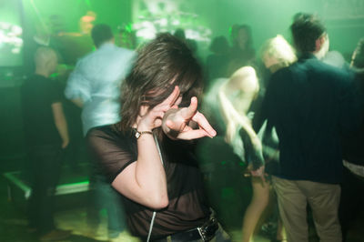 Young woman dancing in nightclub