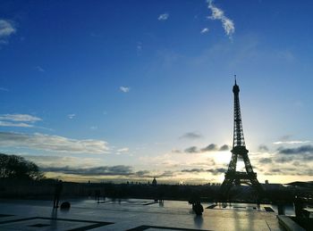 Eiffel tower against sky during sunset