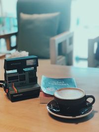 Close-up of coffee cup on table