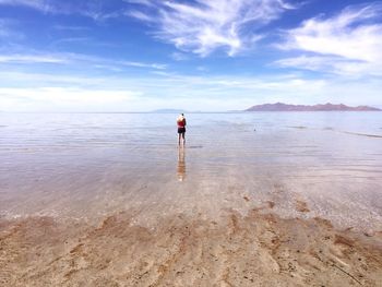 Woman standing on beach