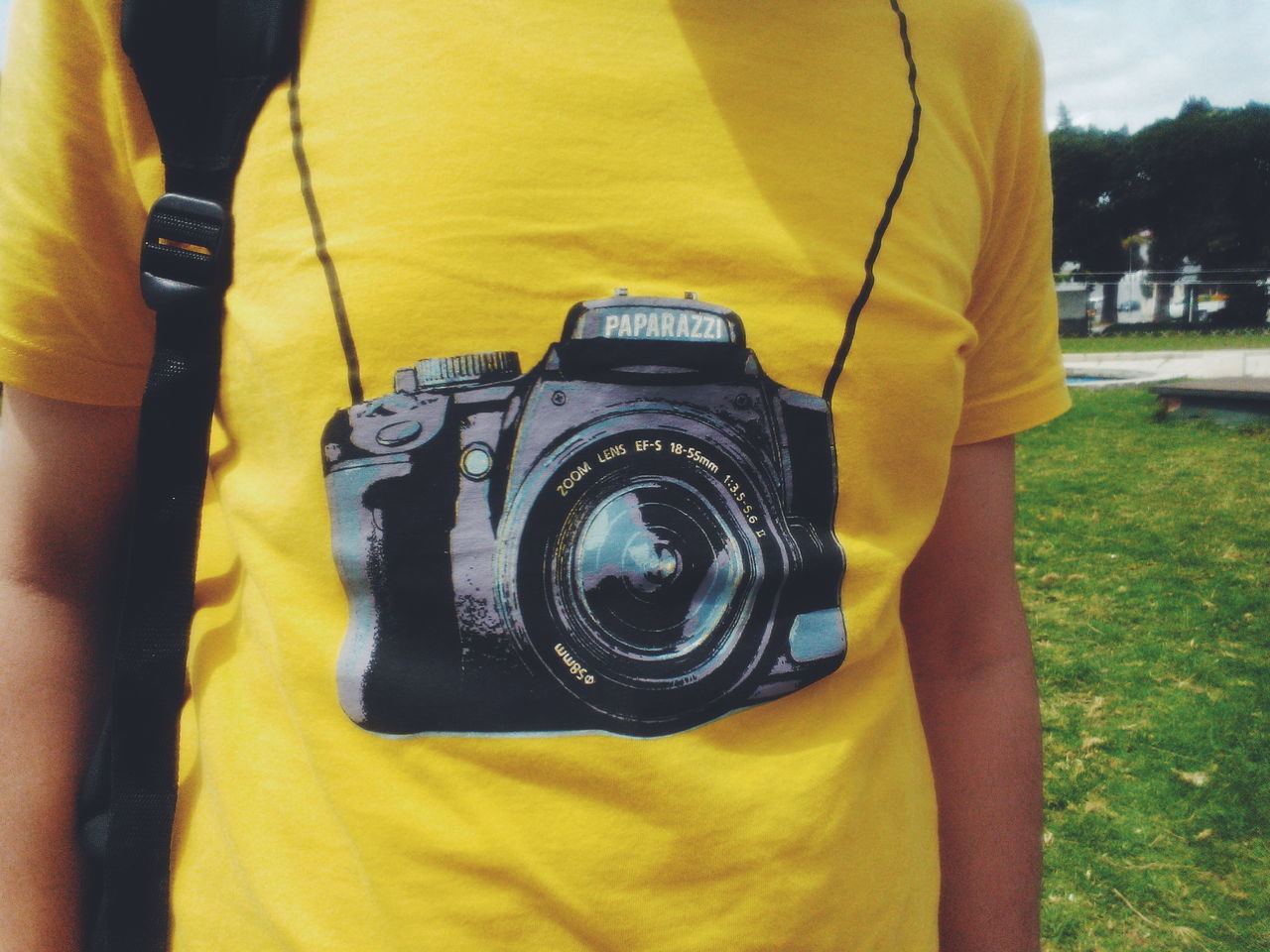 REFLECTION OF MAN PHOTOGRAPHING CAMERA