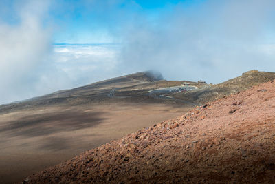 Scenic view of volcanic landscape against sky