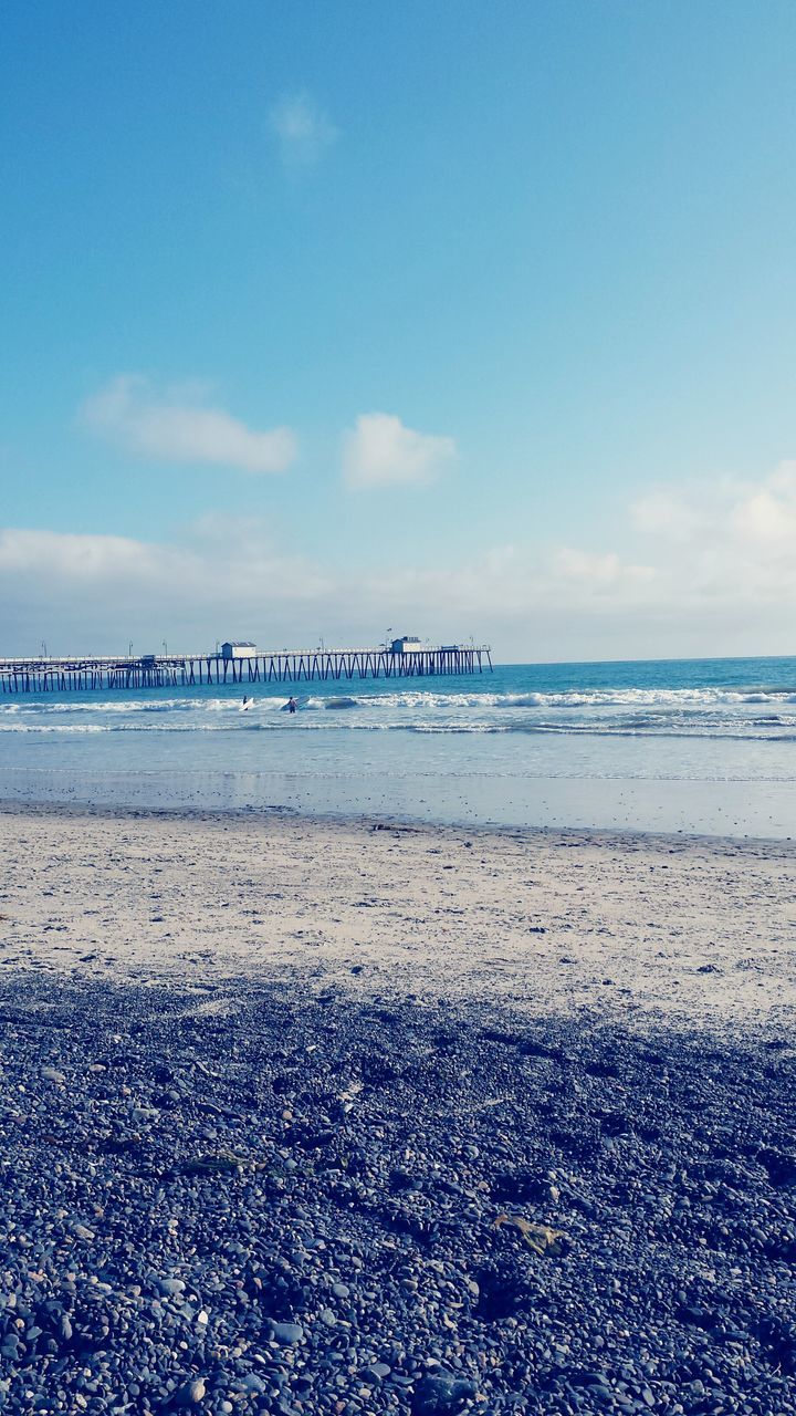 beach, sea, sand, horizon over water, shore, water, sky, scenics, tranquil scene, tranquility, beauty in nature, nature, blue, incidental people, cloud - sky, idyllic, wave, coastline, day, outdoors