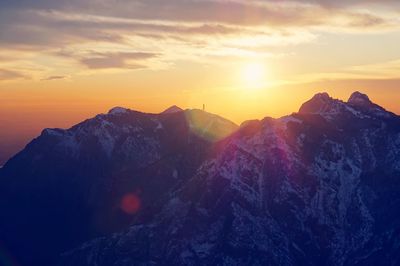 Scenic view of mountains against sky during sunset