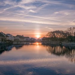 Scenic view of lake against sky during sunset