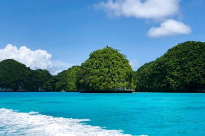 Scenic view of sea against blue sky
