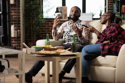 Man and woman talking at home