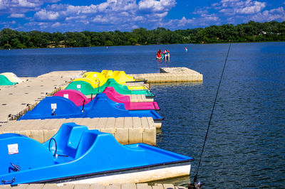 Paddleboats moored at pier