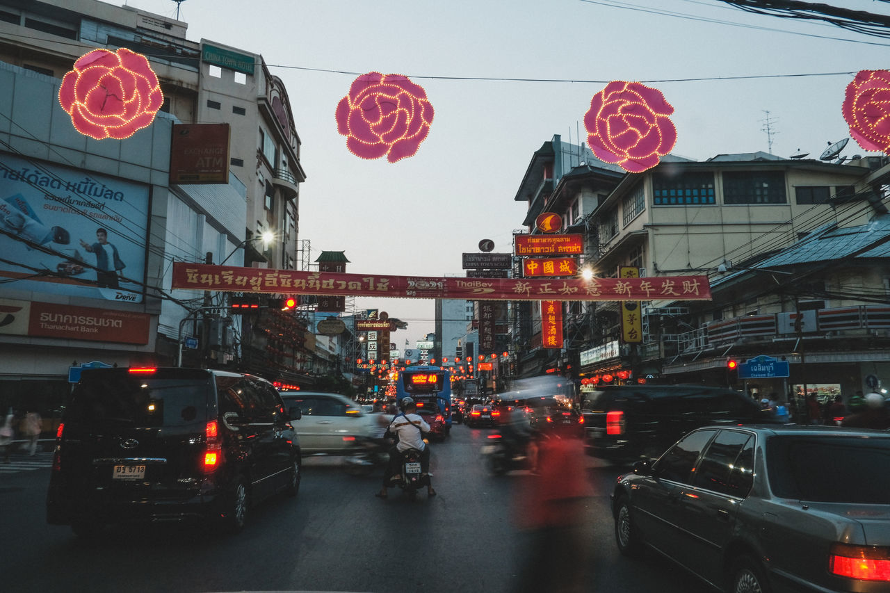 TRAFFIC ON ROAD IN CITY AT NIGHT