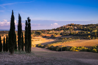 Scenic view of landscape against sky at sunset