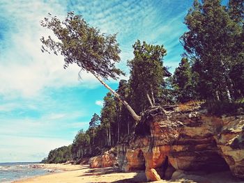 Scenic view of sea against cloudy sky