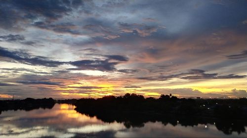 Scenic view of lake against sky during sunset