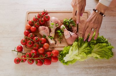 Cropped image of woman hand preparing food in kitchen