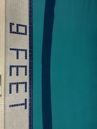 High angle view of cropped poolside