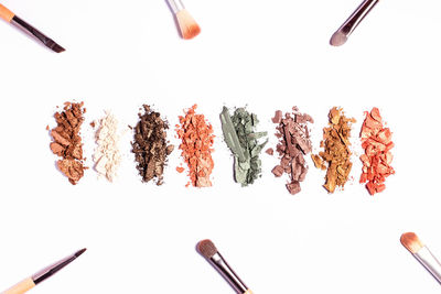 High angle view of berries on white background