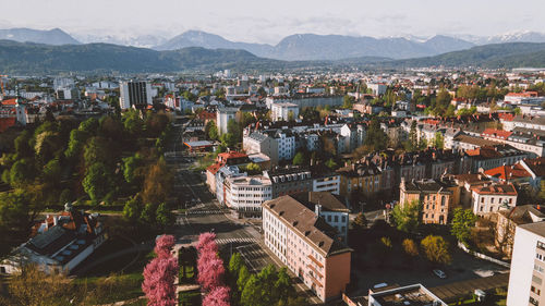 High angle shot of townscape against mountains