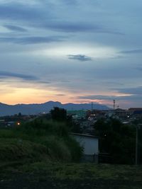 High angle view of buildings against sky at sunset