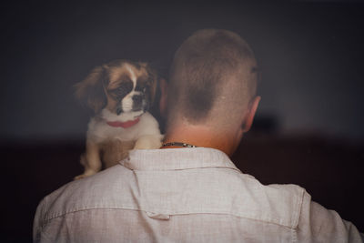 Rear view of man with dog