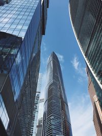 Low angle view of modern buildings against sky